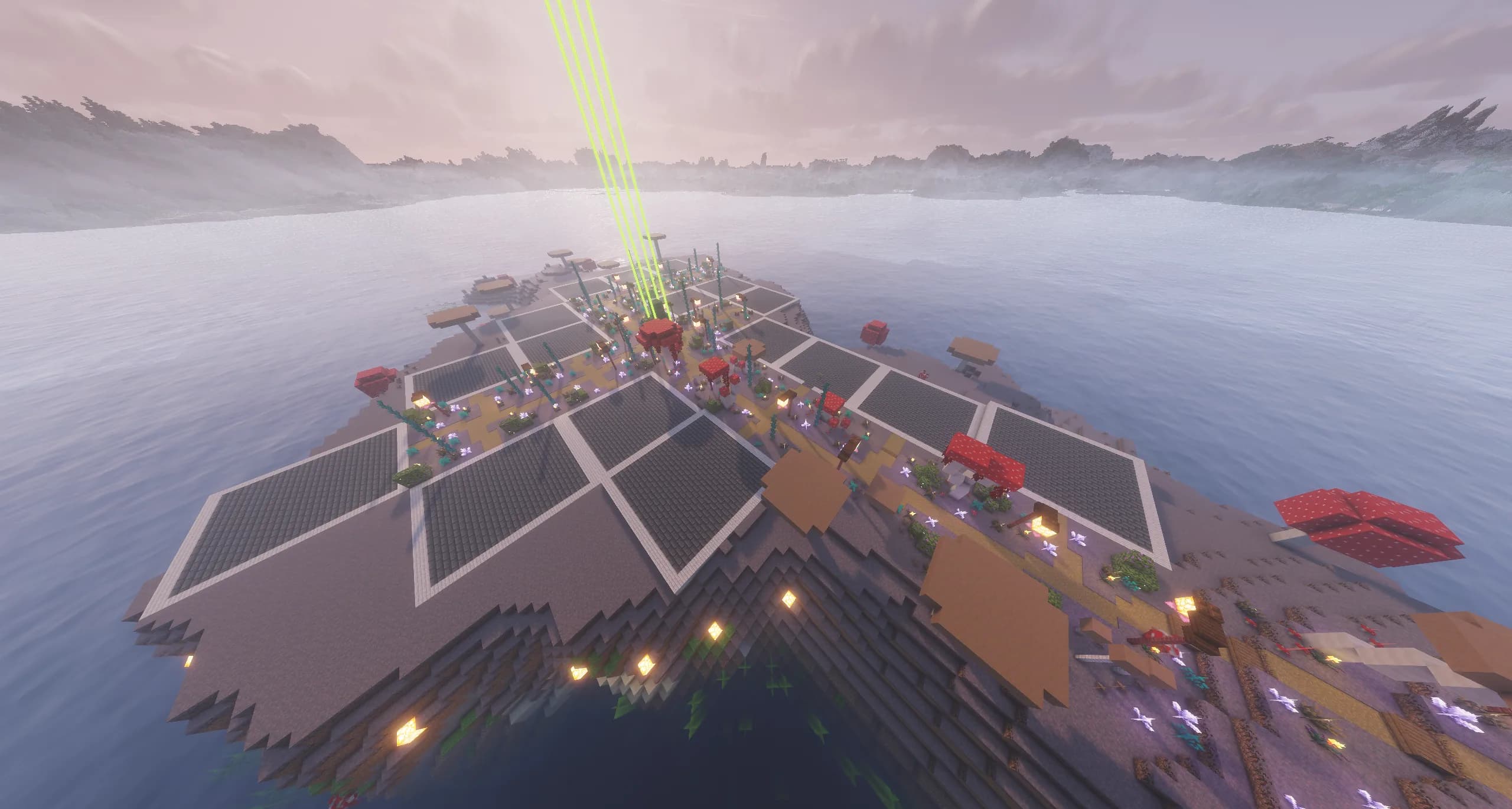 The shopping district from the air: an island of empty shop plots along lantern-lit paths, with giant mushrooms and beacon beams, in a misty lake.